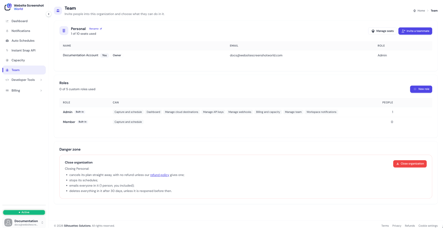 The Team page with the members list, the Roles card listing Admin and Member, and the Close organization panel